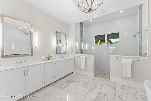 a living room with patio furniture and a wooden floor