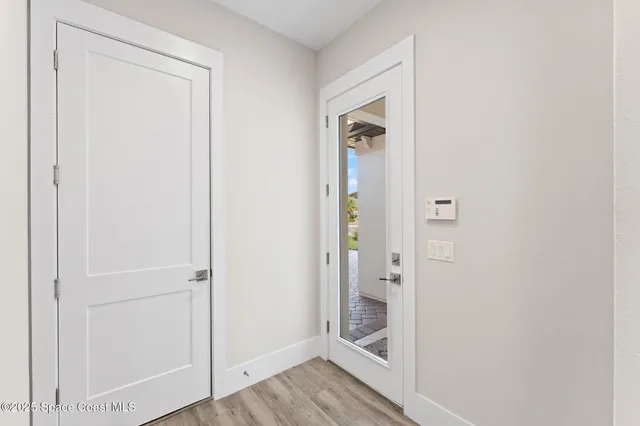 a view of a lake with houses in the back