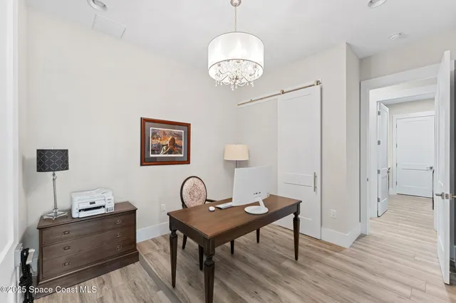 an aerial view of a house with a lake view