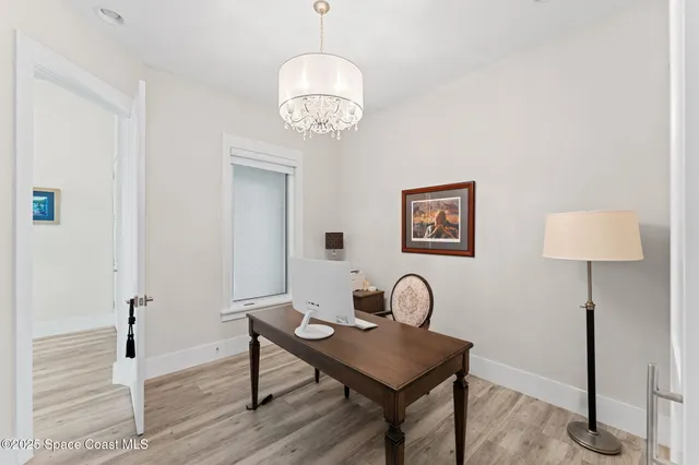 an aerial view of residential houses with outdoor space and river