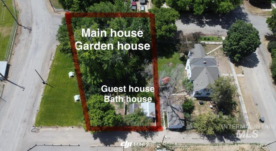 Aerial view of property and surrounding area with property parcel outlined