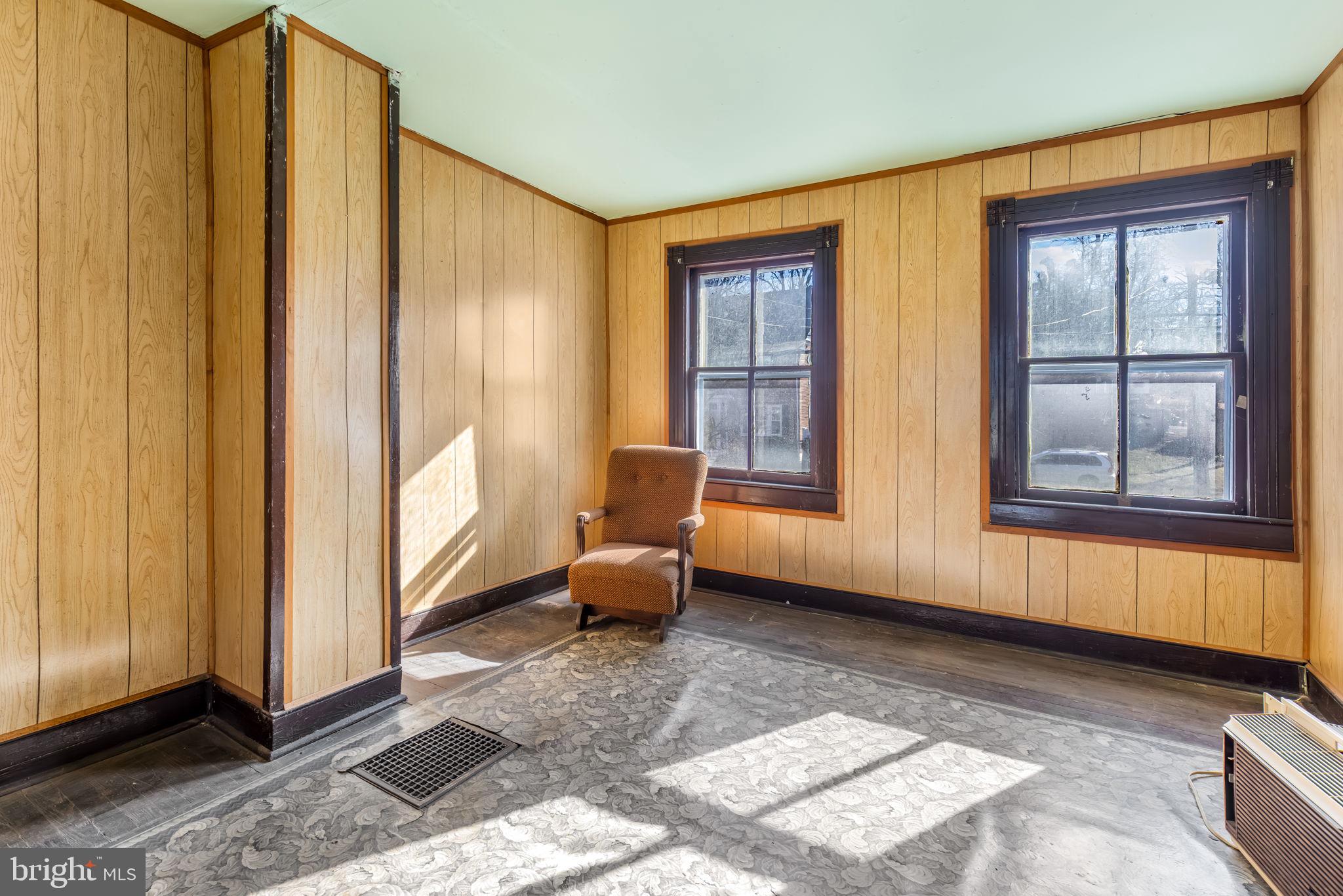 169 East Main Street Orange, VA 22960 - Photo 17 of 27 a living room with furniture and large windows