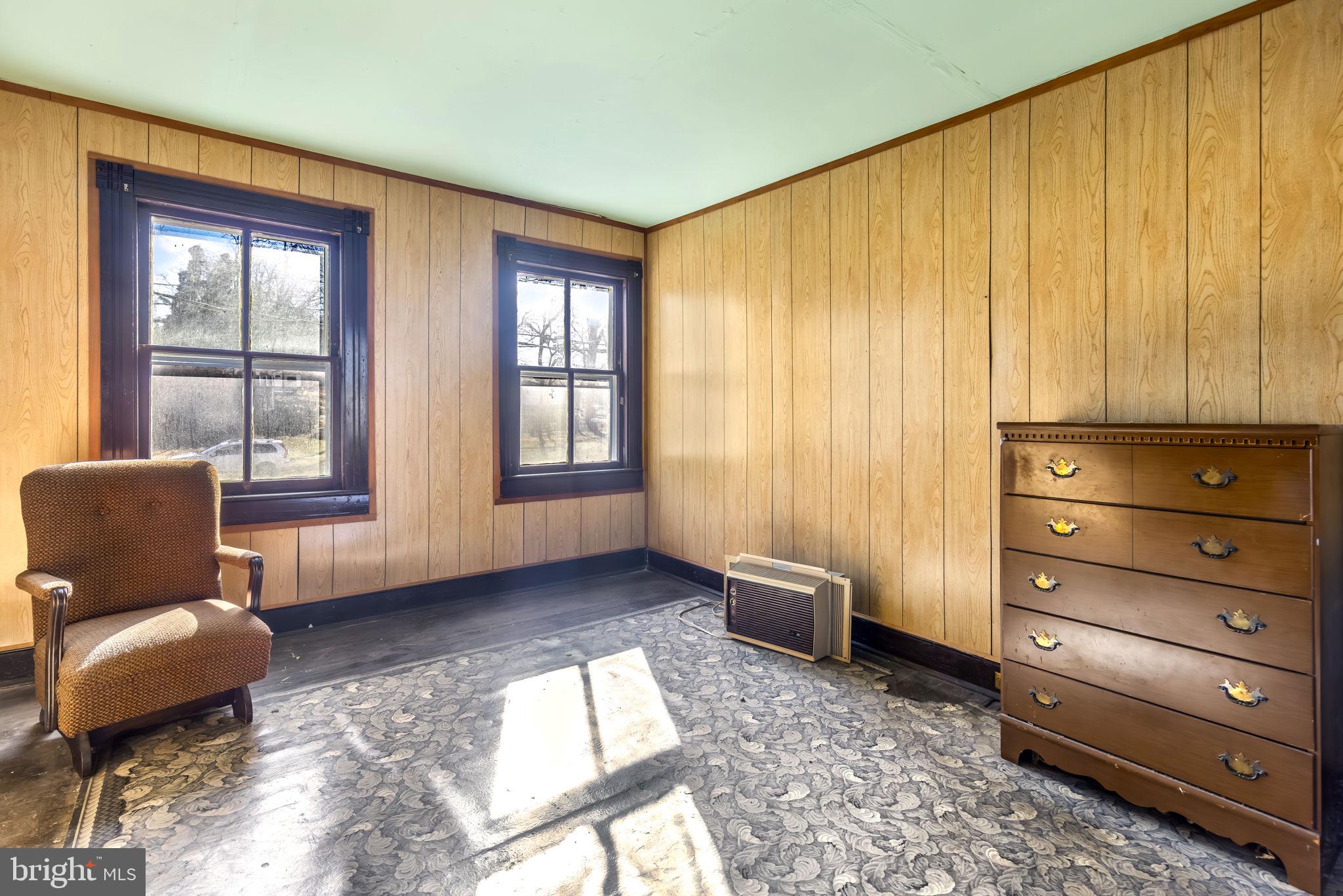 169 East Main Street Orange, VA 22960 - Photo 18 of 27 a living room with furniture and a window
