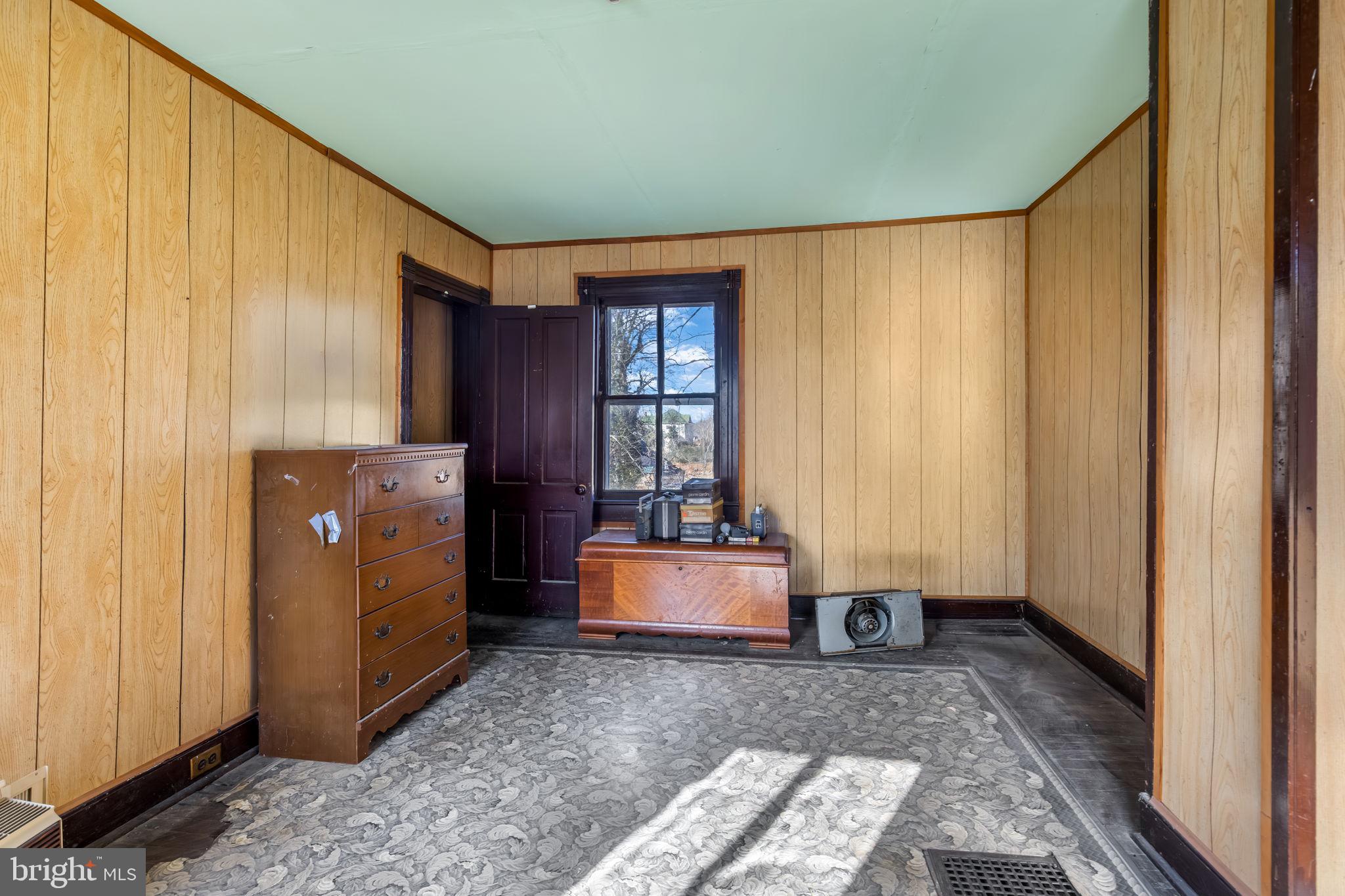 169 East Main Street Orange, VA 22960 - Photo 19 of 27 a room with a bed and a window