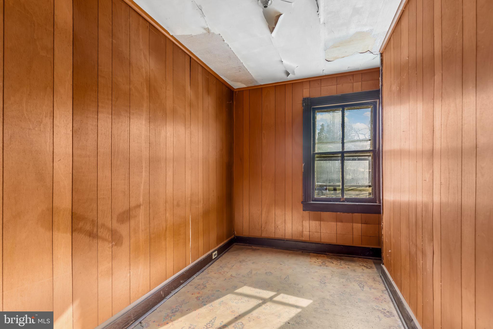 169 East Main Street Orange, VA 22960 - Photo 20 of 27 a view of an empty room with a window
