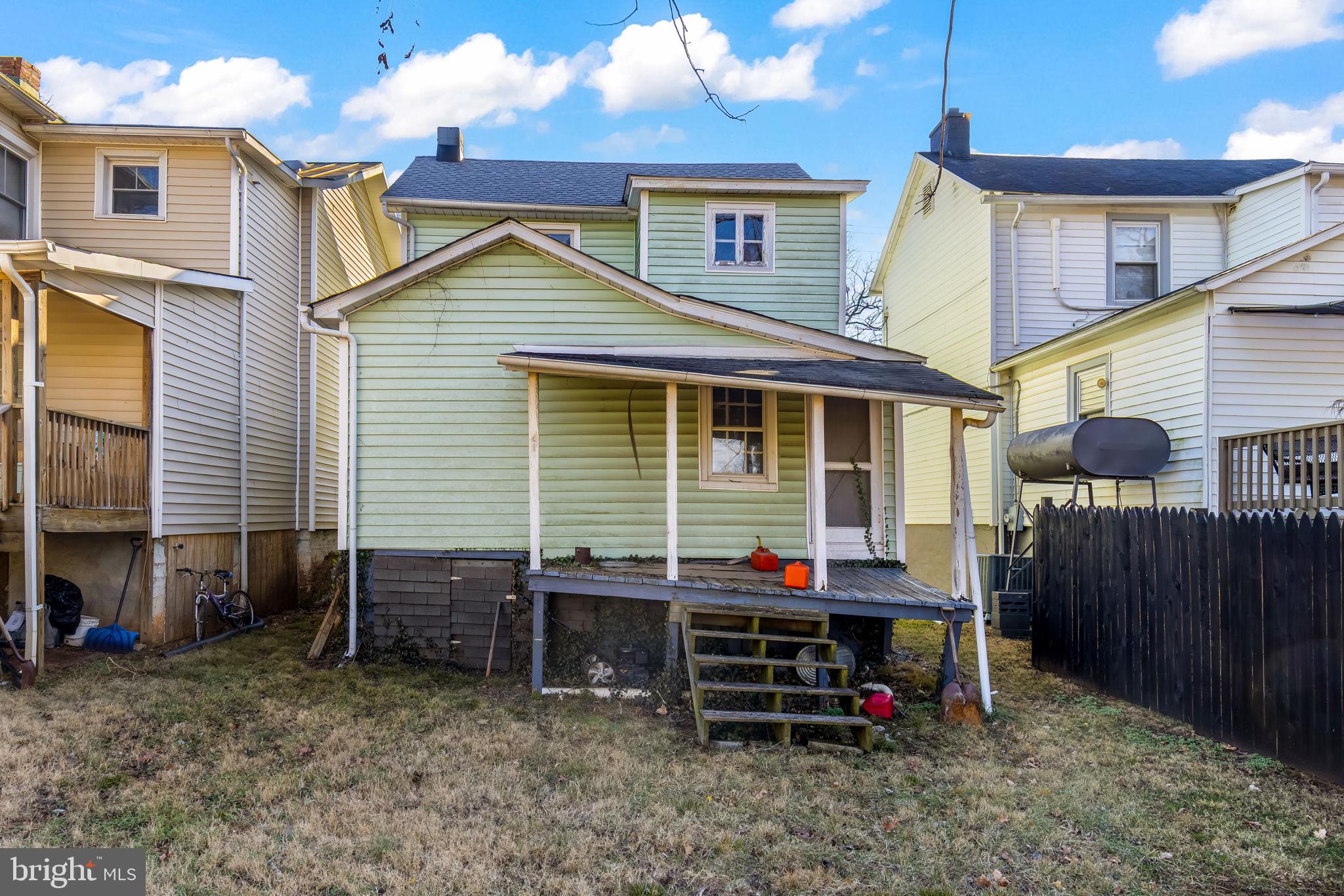 169 East Main Street Orange, VA 22960 - Photo 24 of 27 a backyard of a house with barbeque oven table and chairs