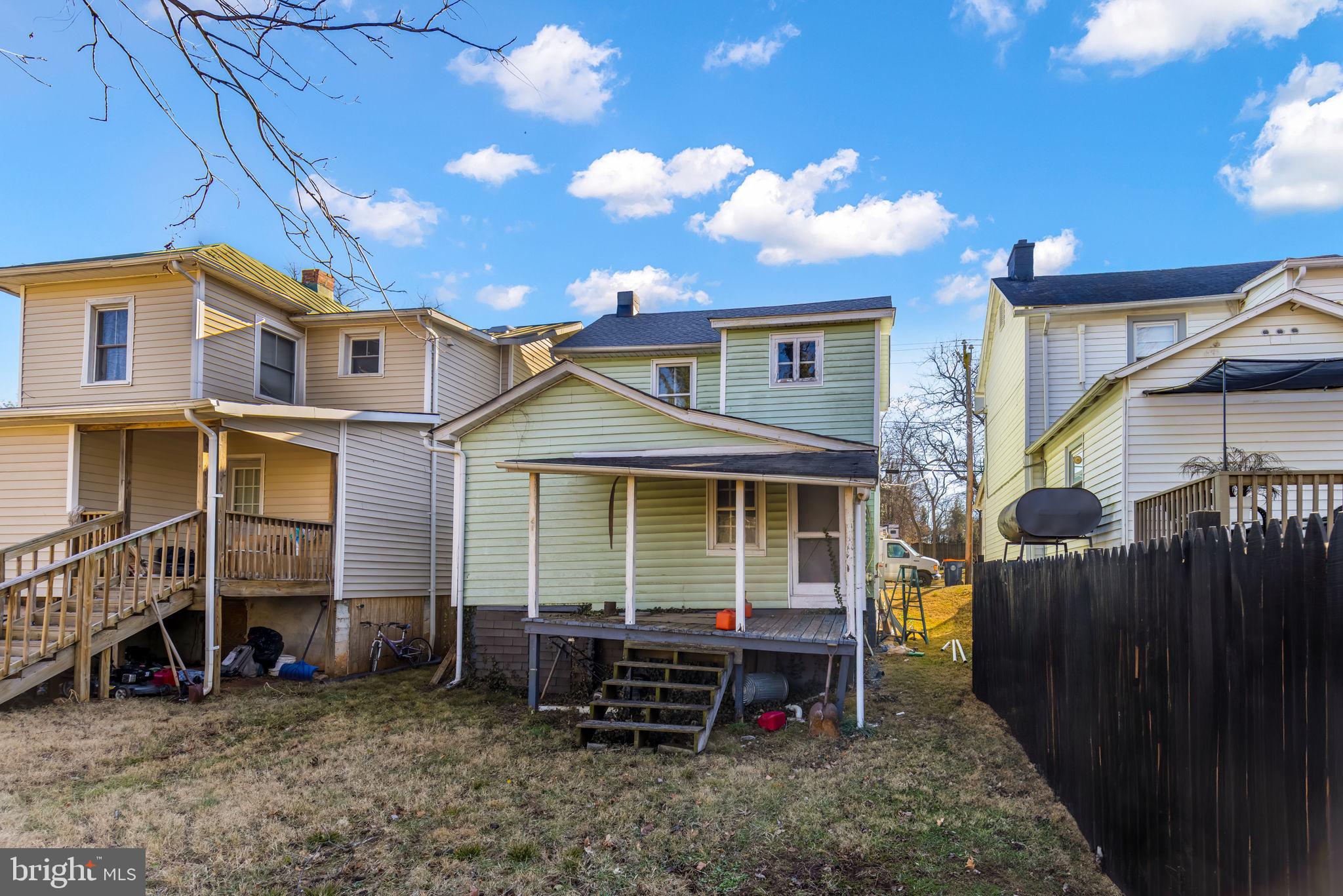 169 East Main Street Orange, VA 22960 - Photo 26 of 27 a view of a house with a yard and wooden fence
