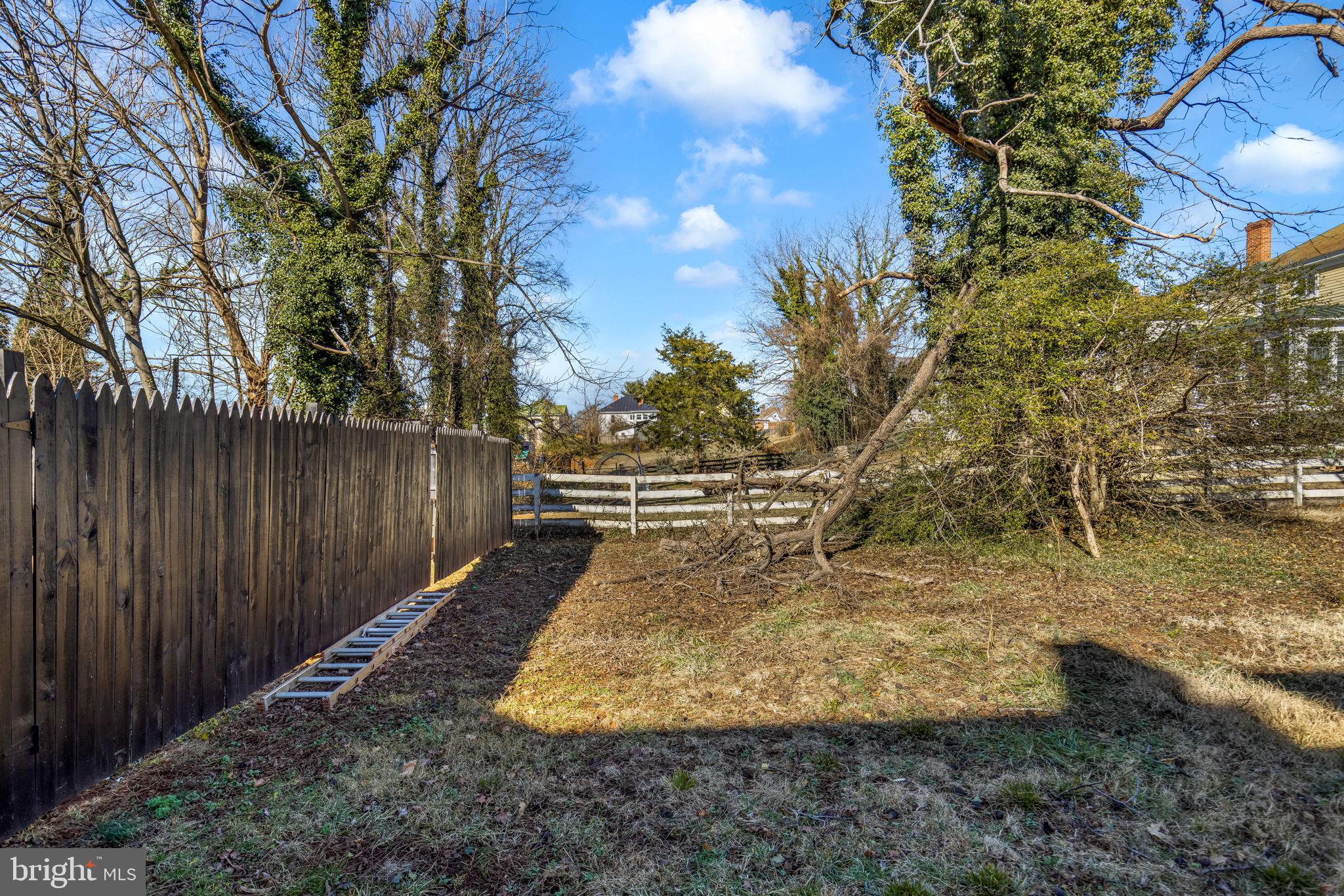 169 East Main Street Orange, VA 22960 - Photo 27 of 27 a view of a yard with wooden fence