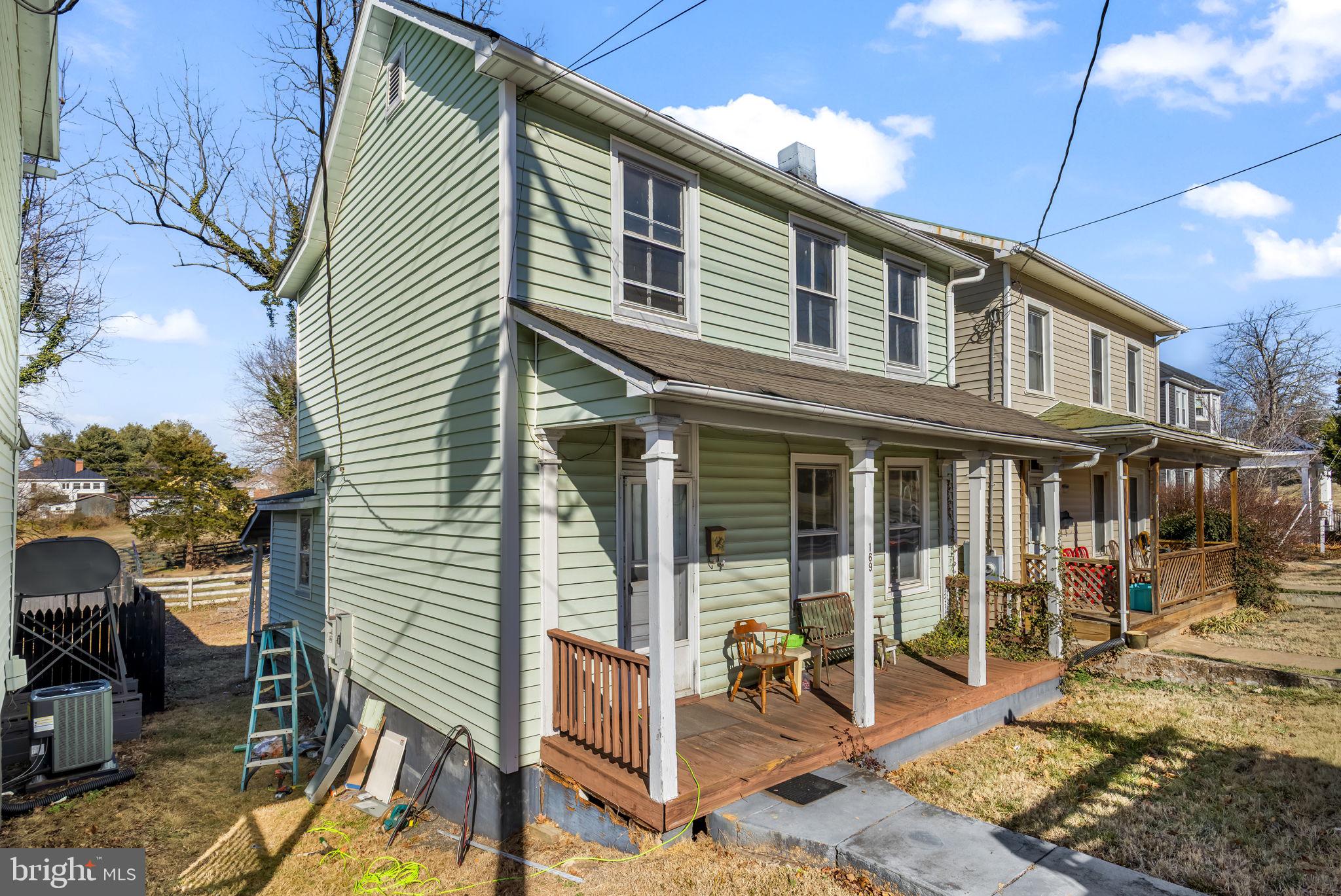 169 East Main Street Orange, VA 22960 - Photo 3 of 27 a view of a house with backyard and porch