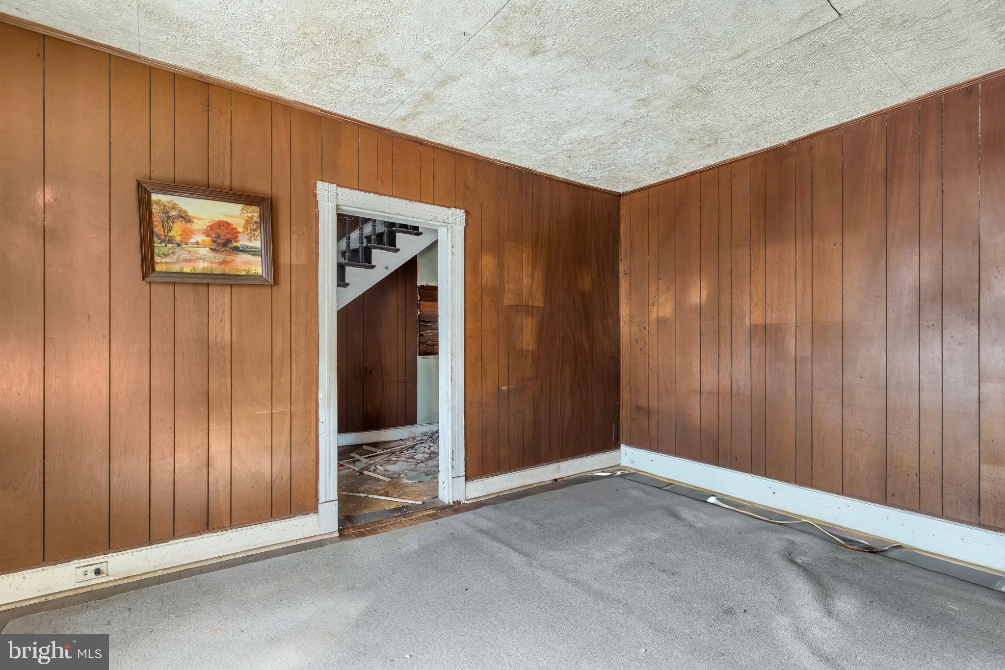 169 East Main Street Orange, VA 22960 - Photo 8 of 27 an empty room with wooden door