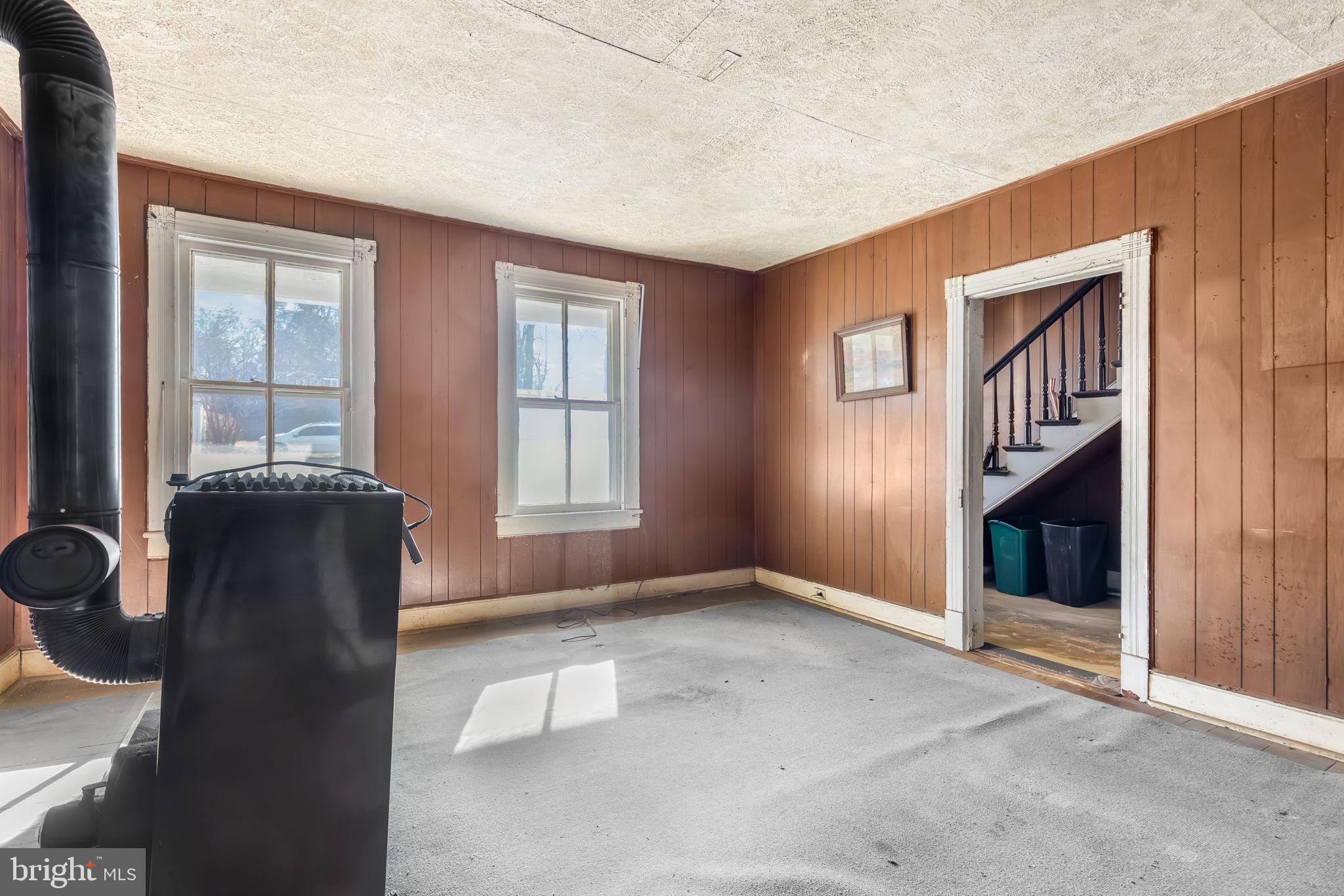 169 East Main Street Orange, VA 22960 - Photo 9 of 27 an empty room with windows & cabinet