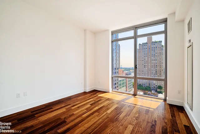 a bathroom with a shower sink and mirror
