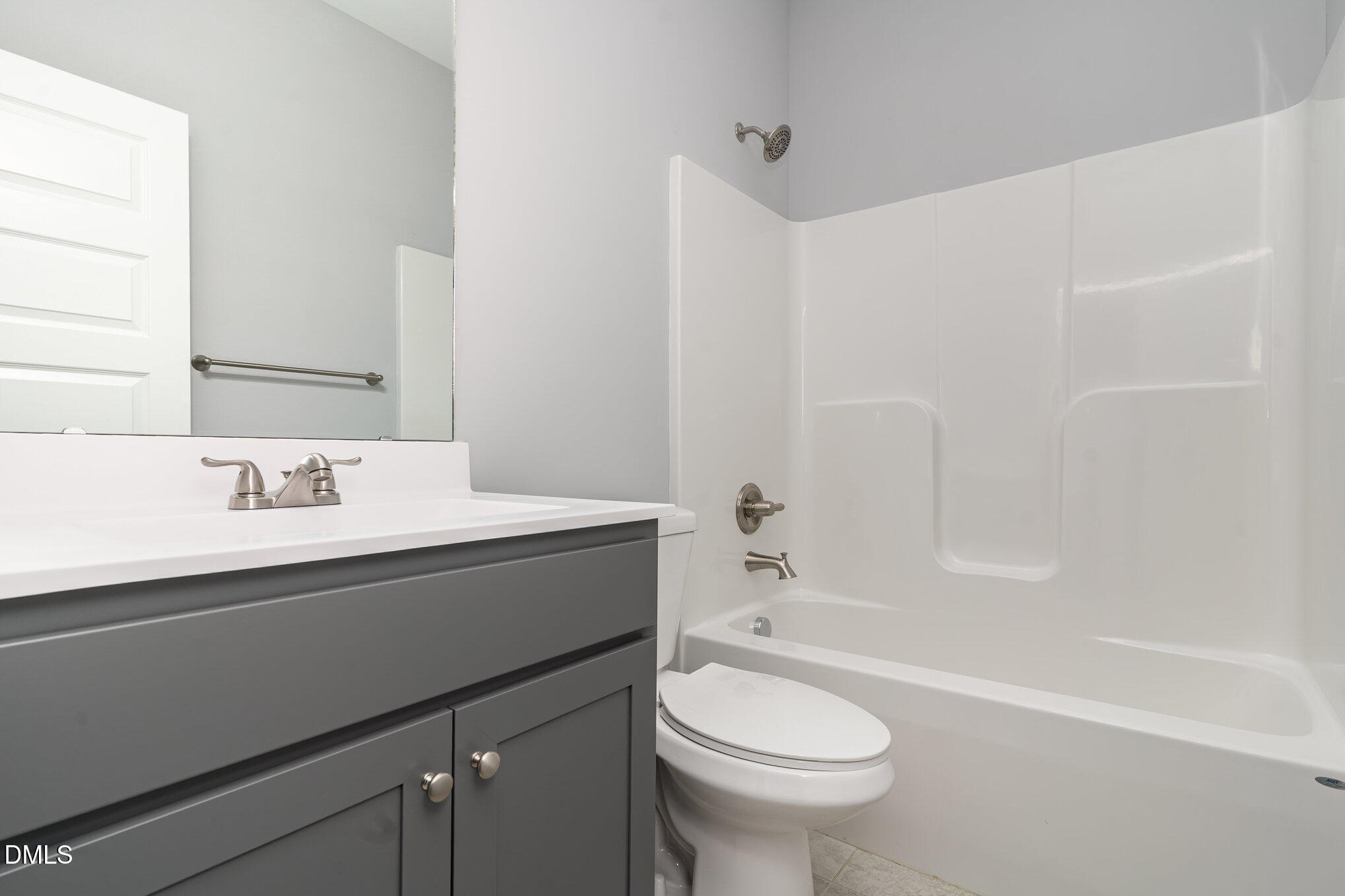 88 Bodacious Lane Benson, NC 27504 - Photo 14 of 32 a bathroom with a granite countertop sink toilet and shower