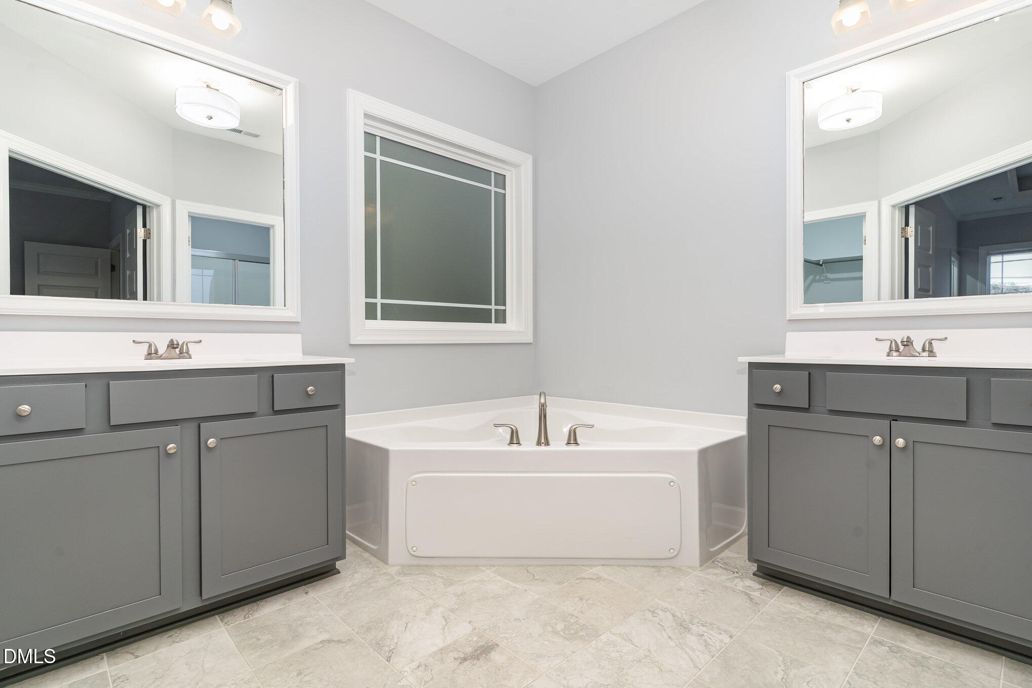 88 Bodacious Lane Benson, NC 27504 - Photo 20 of 32 a bathroom with a bathtub sink and mirror