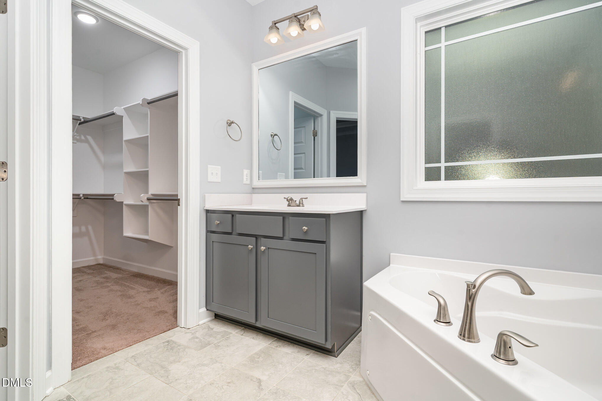 88 Bodacious Lane Benson, NC 27504 - Photo 21 of 32 a bathroom with a sink and a mirror