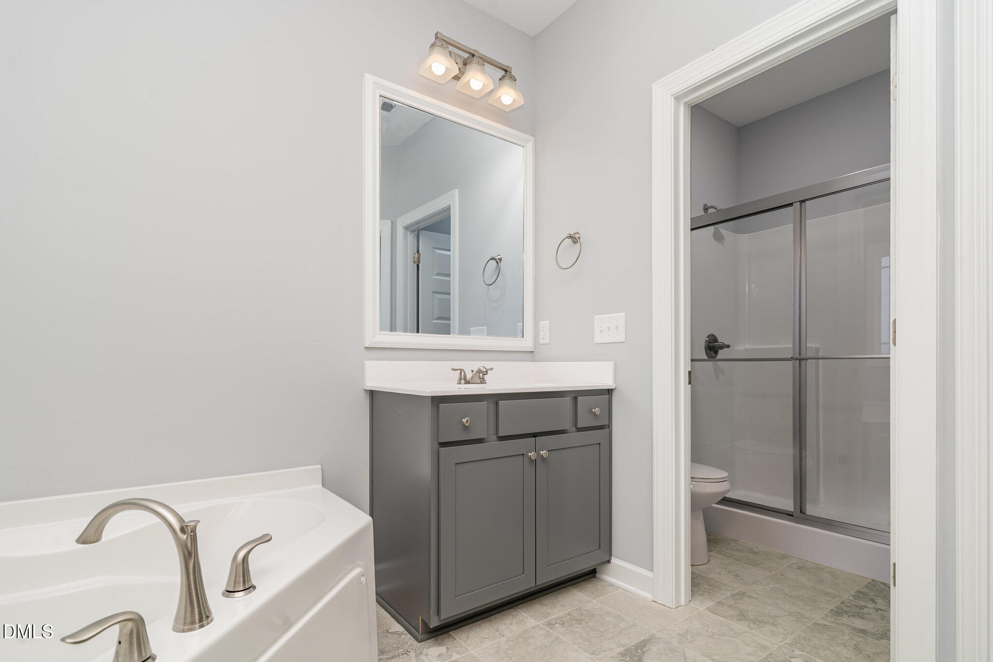 88 Bodacious Lane Benson, NC 27504 - Photo 23 of 32 a bathroom with a bathtub and a sink