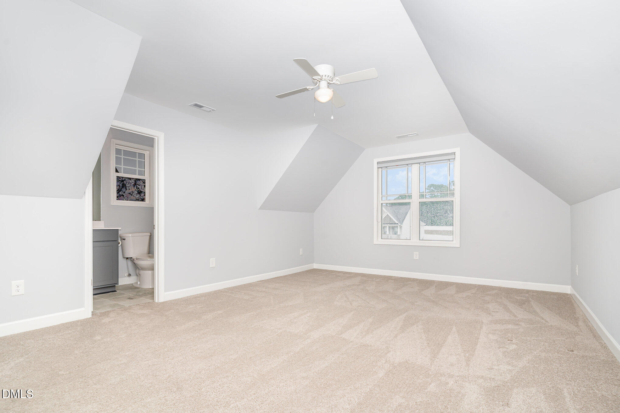 88 Bodacious Lane Benson, NC 27504 - Photo 24 of 32 an empty room with windows and ceiling fan