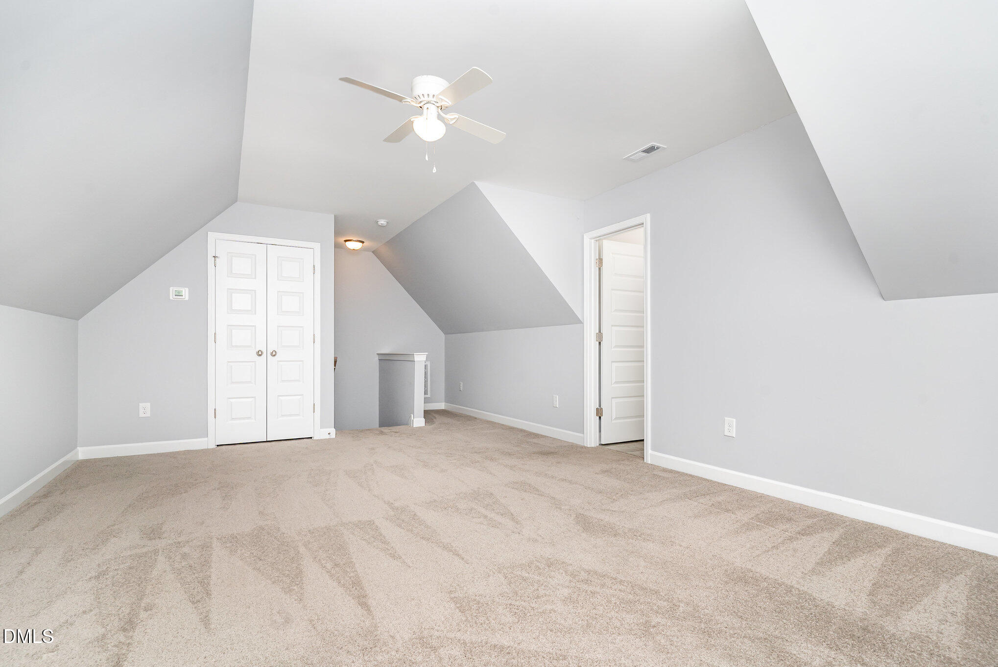 88 Bodacious Lane Benson, NC 27504 - Photo 25 of 32 an empty room with windows and fan