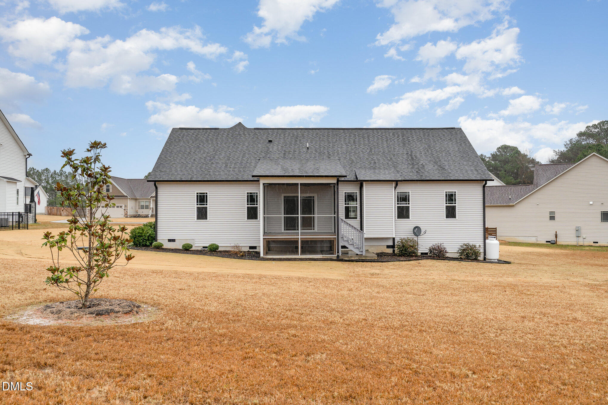 88 Bodacious Lane Benson, NC 27504 - Photo 30 of 32 a front view of a house with a yard and garage