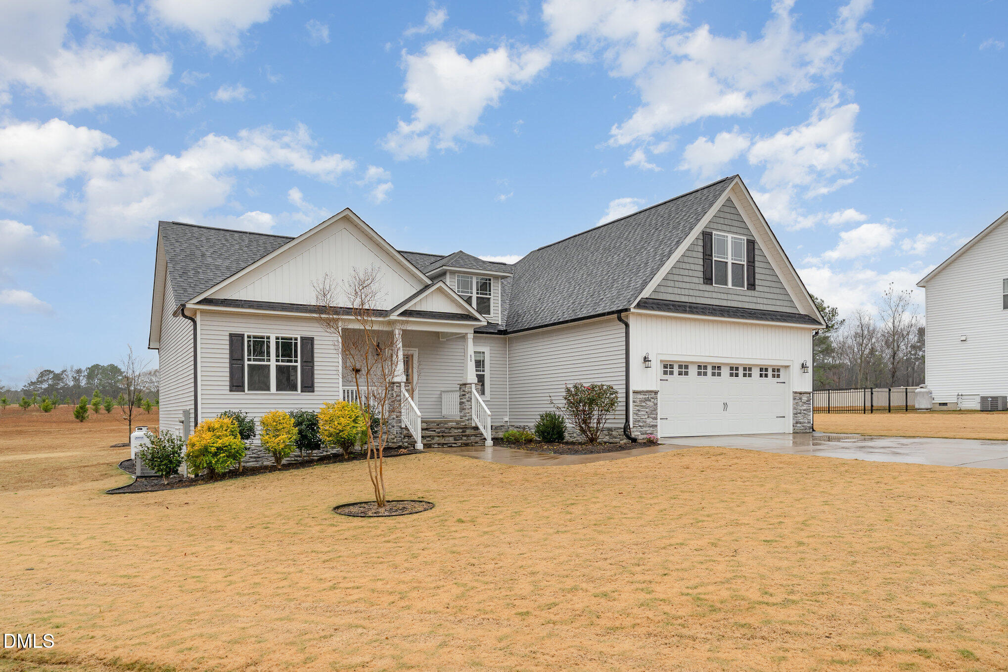 88 Bodacious Lane Benson, NC 27504 - Photo 3 of 32 a front view of a house with garden