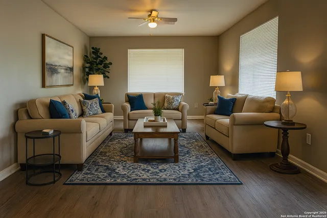 a living room with furniture and a lamp
