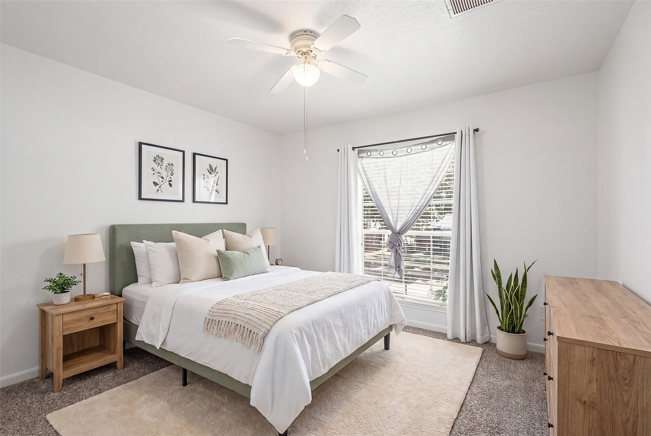 28723 Sedgefield Street Spring, TX 77386 - Photo 16 of 20 a bedroom with a large bed and a chandelier