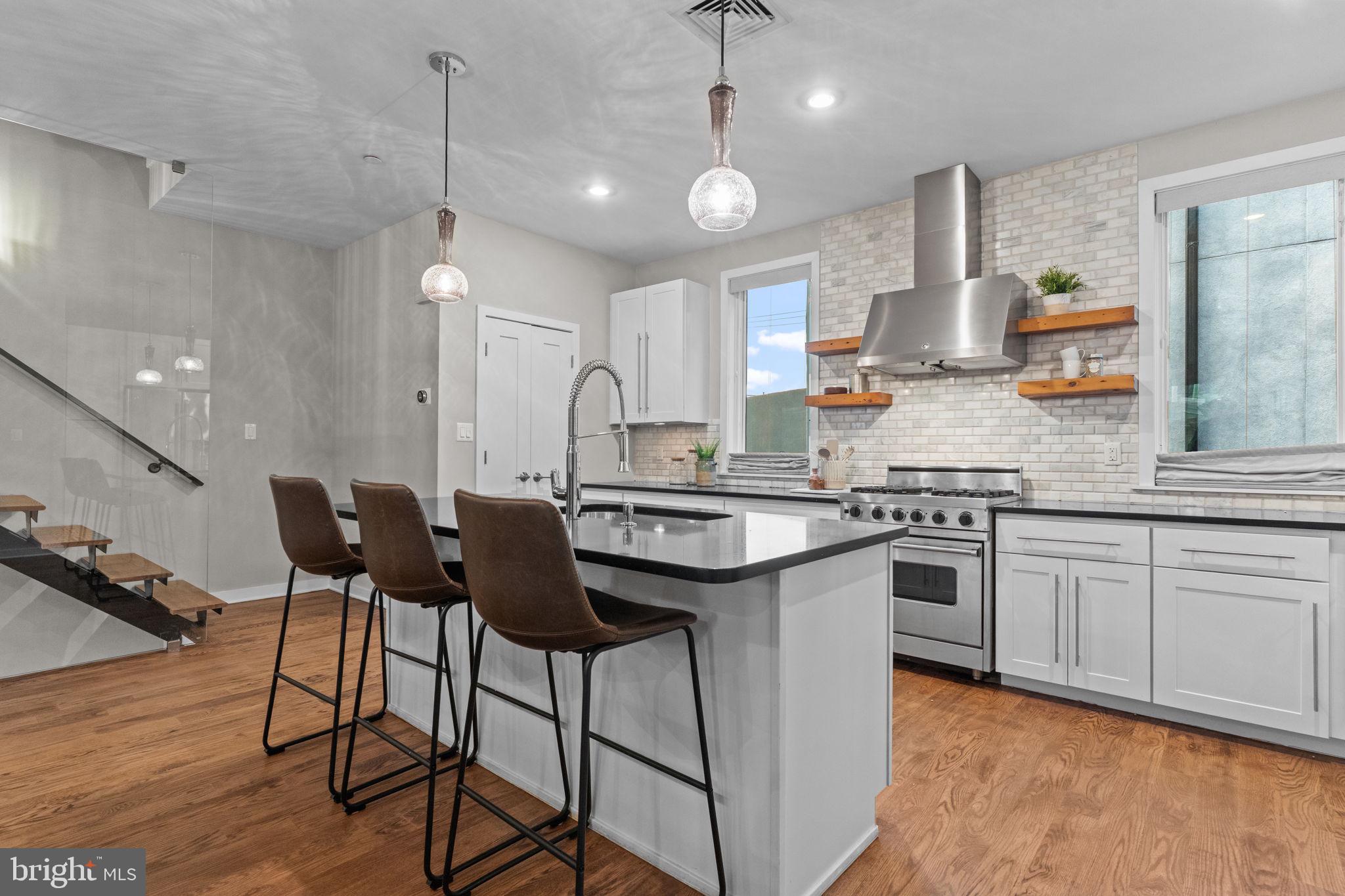 412 Moyer Street, Unit 7 Philadelphia, PA 19125 - Photo 21 of 55 a kitchen with a sink cabinets and window
