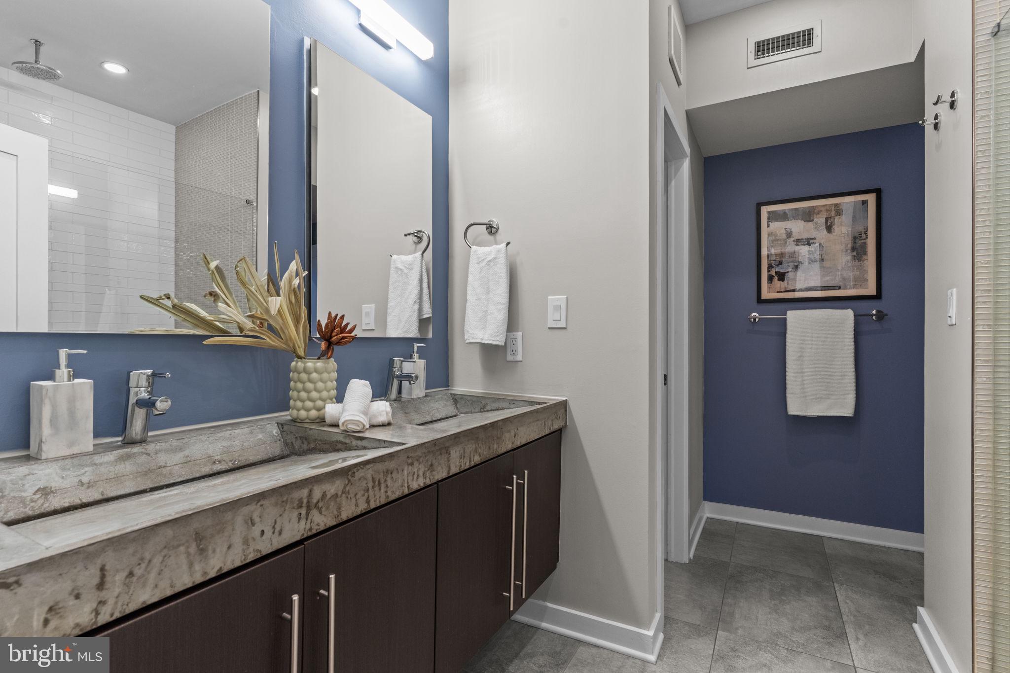 412 Moyer Street, Unit 7 Philadelphia, PA 19125 - Photo 27 of 55 a bathroom with a granite countertop sink and a mirror