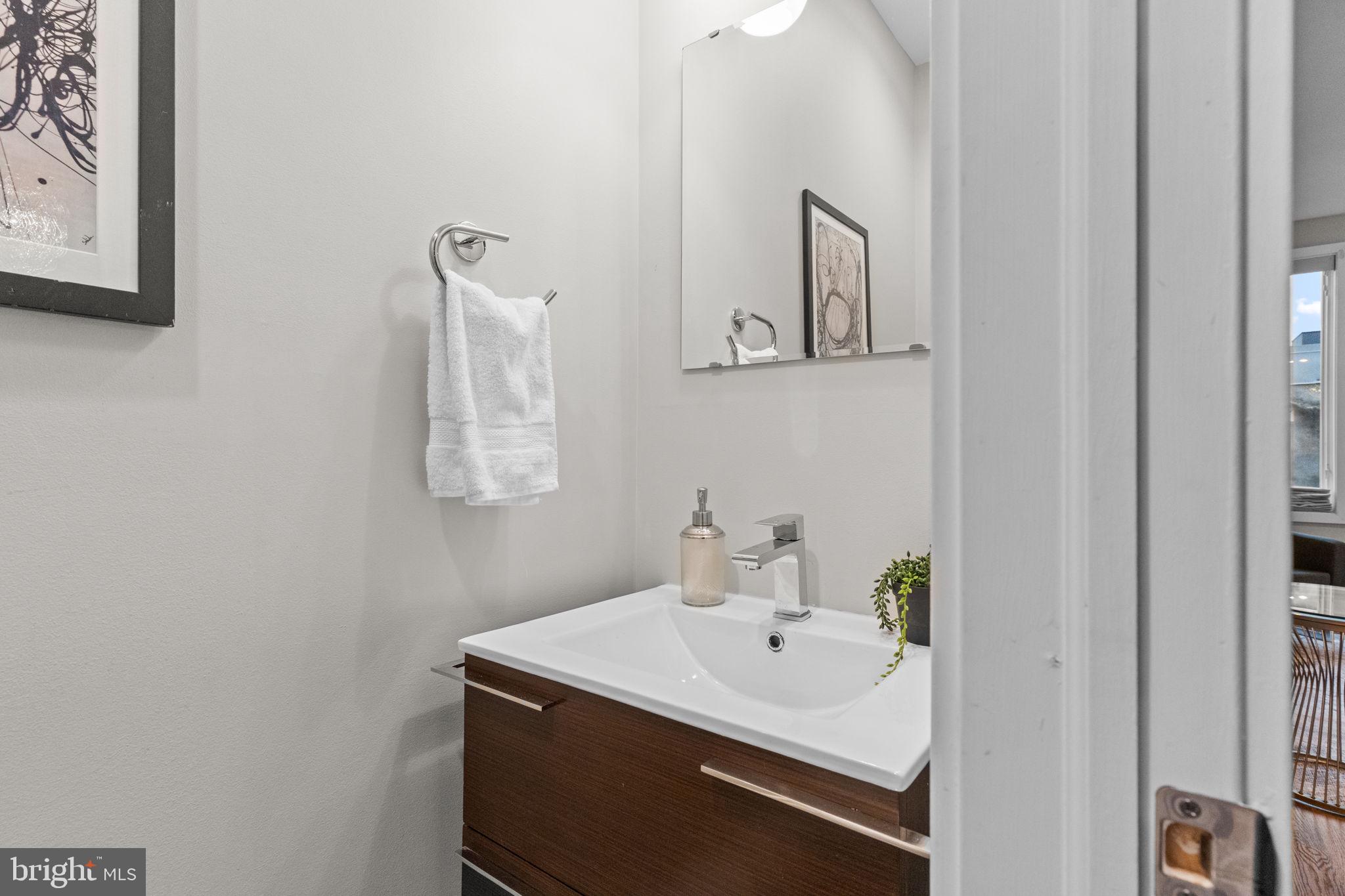 412 Moyer Street, Unit 7 Philadelphia, PA 19125 - Photo 37 of 55 a bathroom with a sink and a mirror