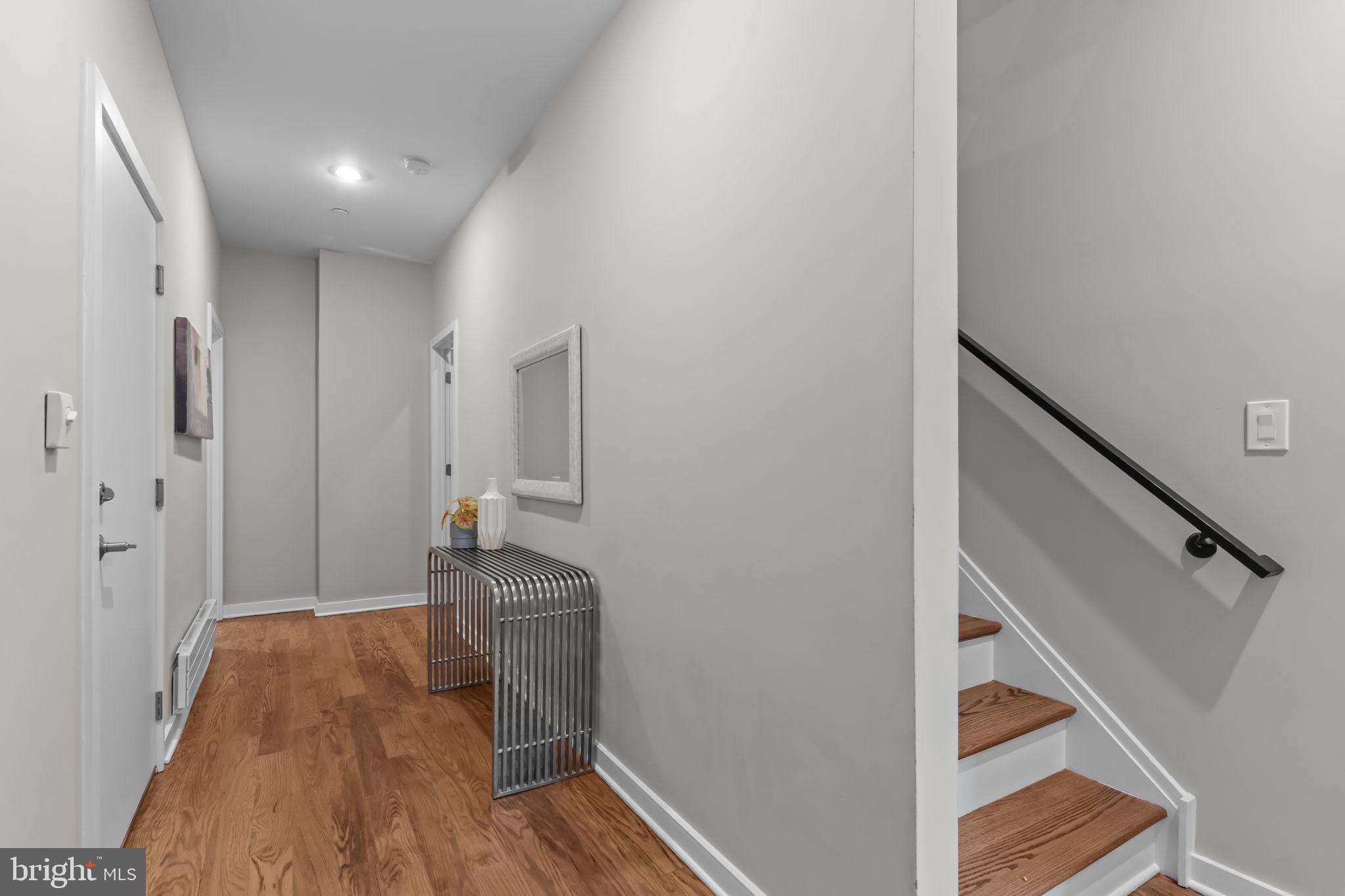 412 Moyer Street, Unit 7 Philadelphia, PA 19125 - Photo 5 of 55 a view of hallway with wooden floor