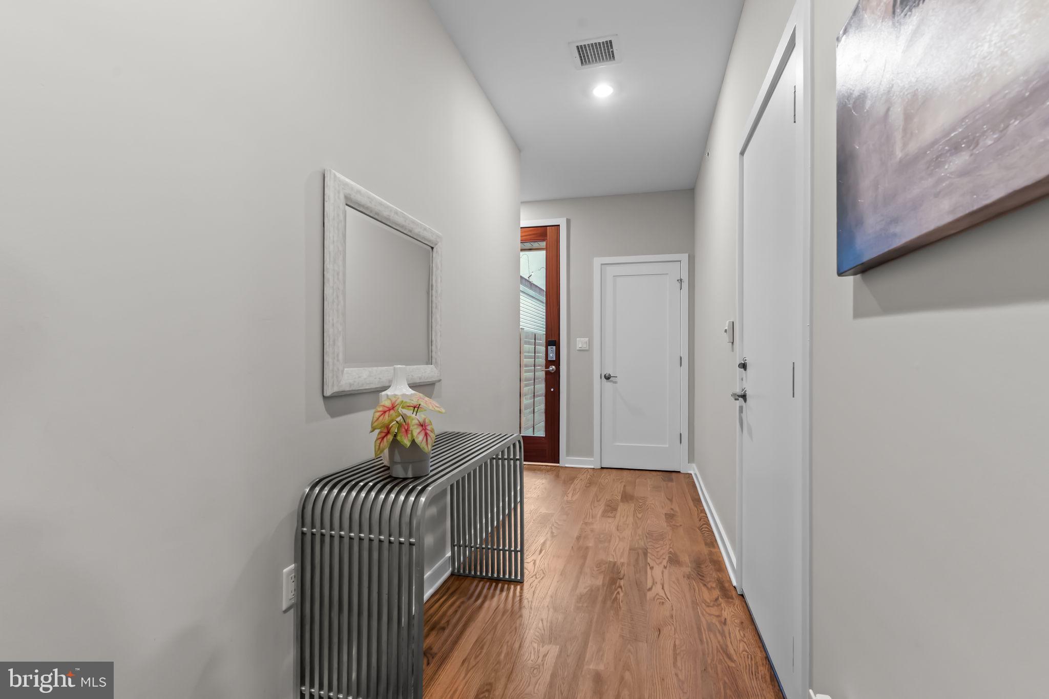 412 Moyer Street, Unit 7 Philadelphia, PA 19125 - Photo 6 of 55 a view of a hallway with wooden floor