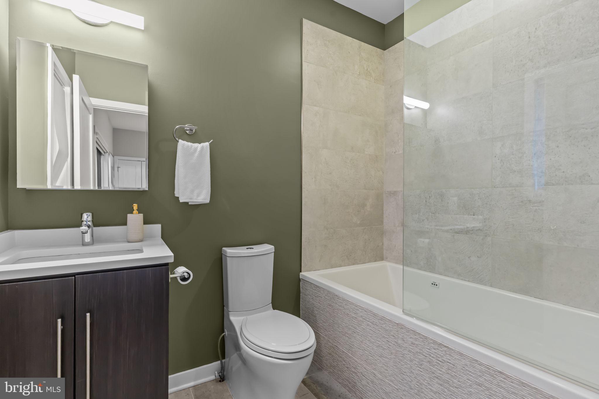 412 Moyer Street, Unit 7 Philadelphia, PA 19125 - Photo 9 of 55 a bathroom with a sink toilet and shower