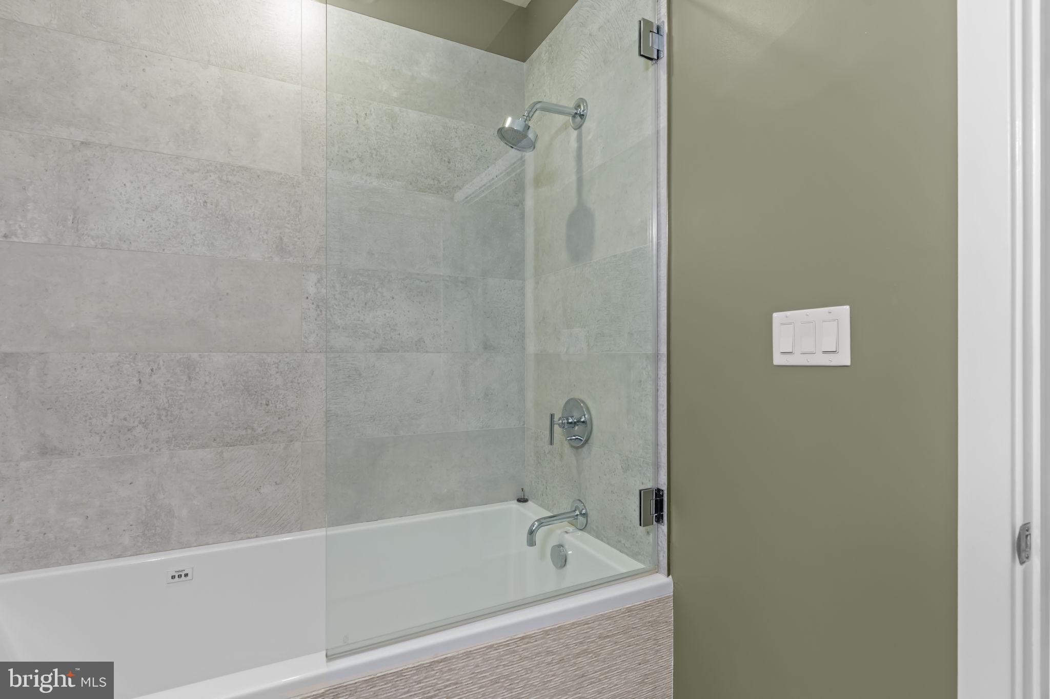 412 Moyer Street, Unit 7 Philadelphia, PA 19125 - Photo 10 of 55 a bathroom with a bathtub and a shower