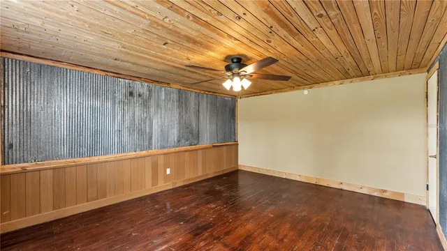 a room with a large window and chandelier