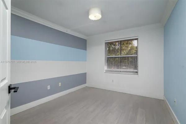 a view of a house with a yard and tree s