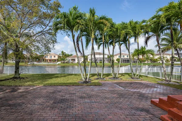 a view of a lake with houses in the back