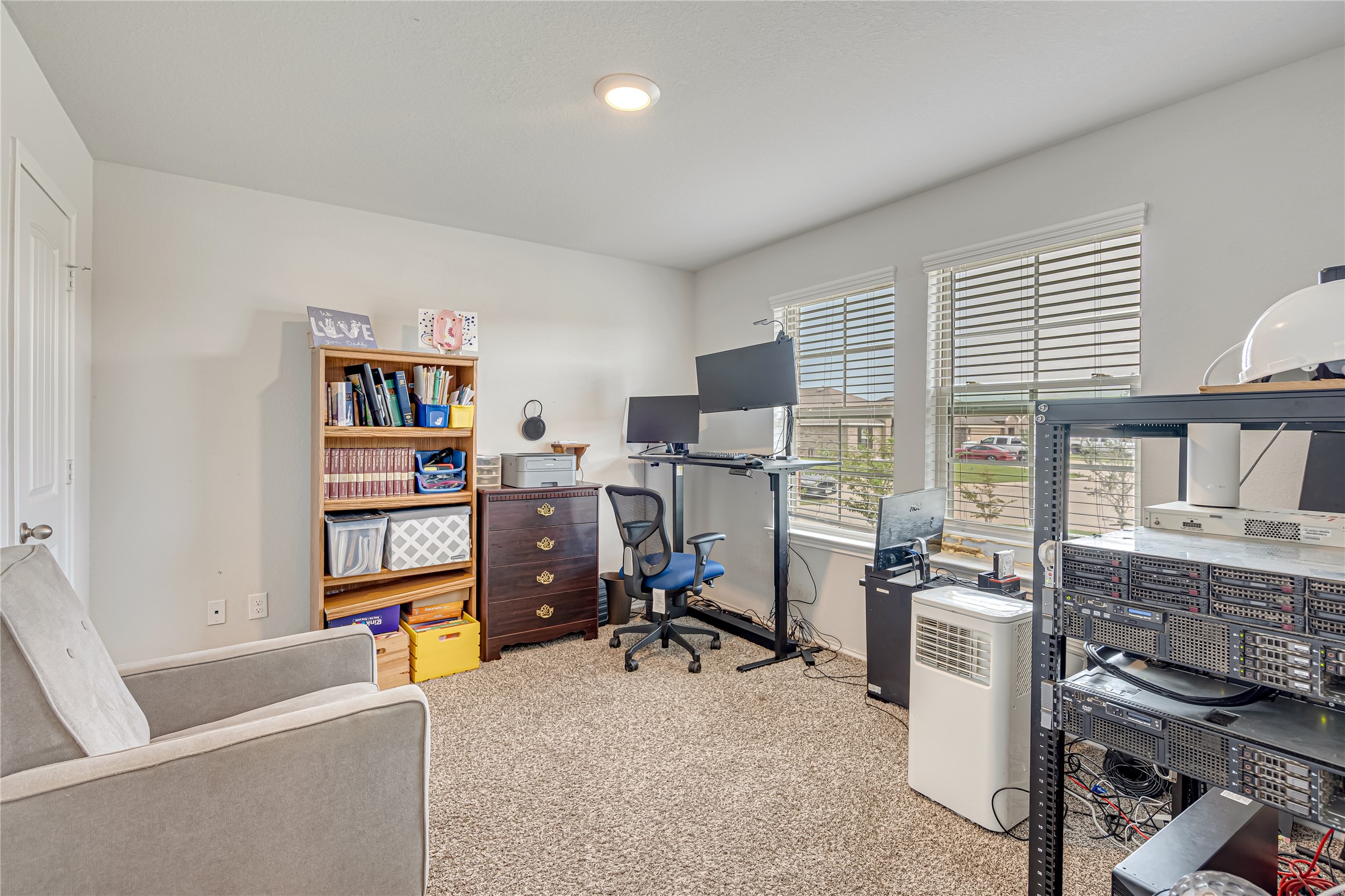 8022 Front Nine Lane Navasota, TX 77868 - Photo 19 of 30 a view of a workspace with furniture and a window