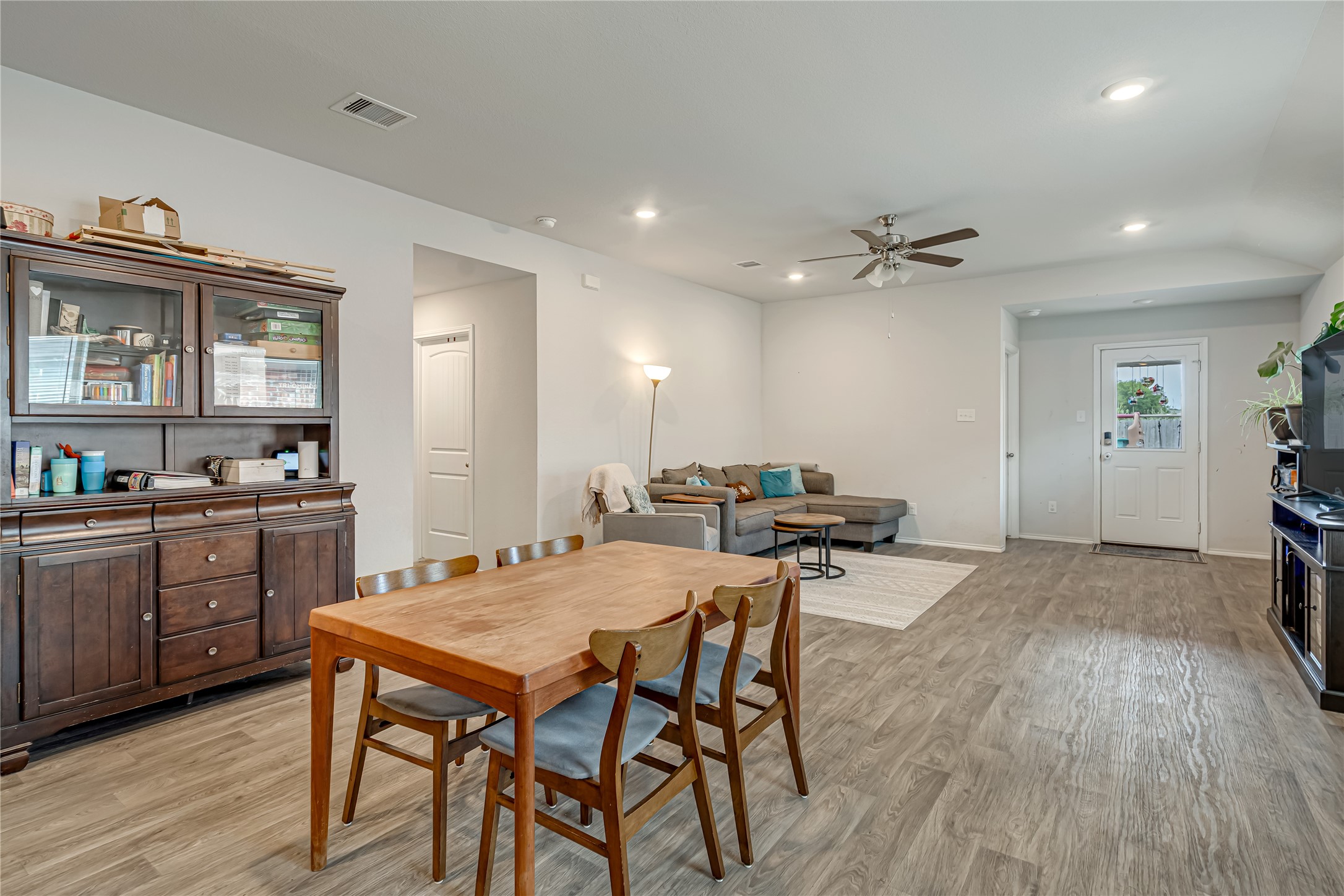 8022 Front Nine Lane Navasota, TX 77868 - Photo 4 of 30 a view of a dining room with furniture and wooden floor