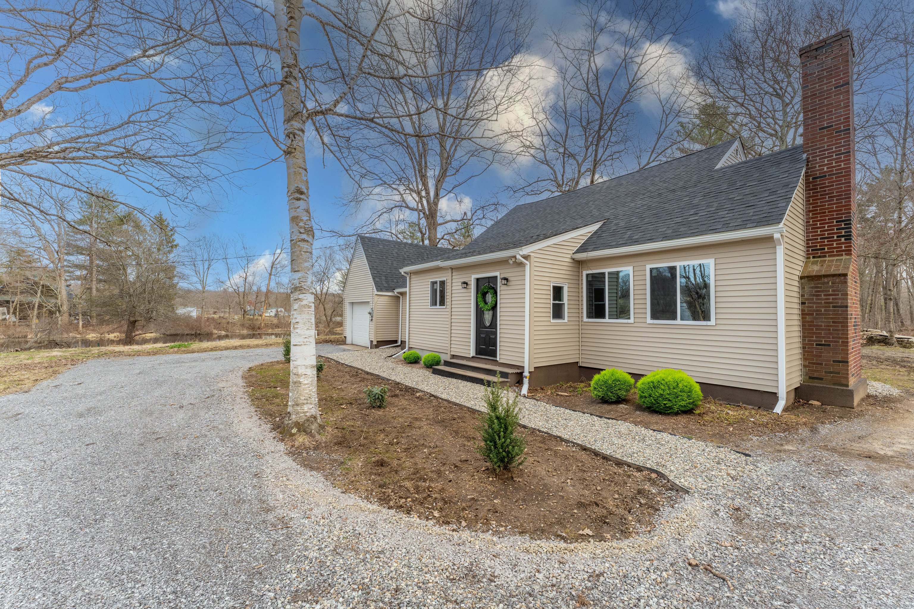 44 Rich Road Pomfret, CT 06259 - Photo 1 of 1 a front view of a house with garden