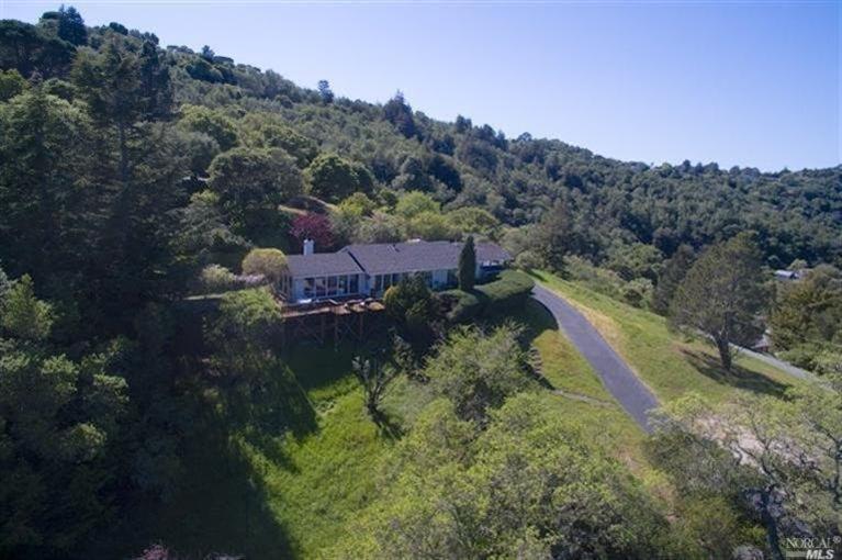 a aerial view of a house with a yard