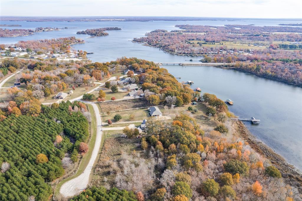 181 County Road 1505 Alba, TX 75410 - Photo 2 of 16 an aerial view of residential houses with outdoor space