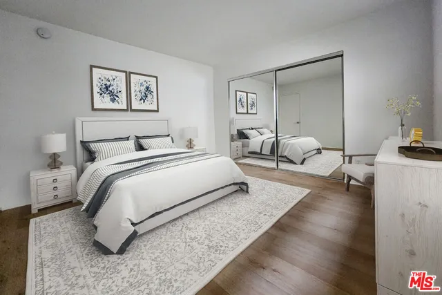 a bedroom with bed and a couch