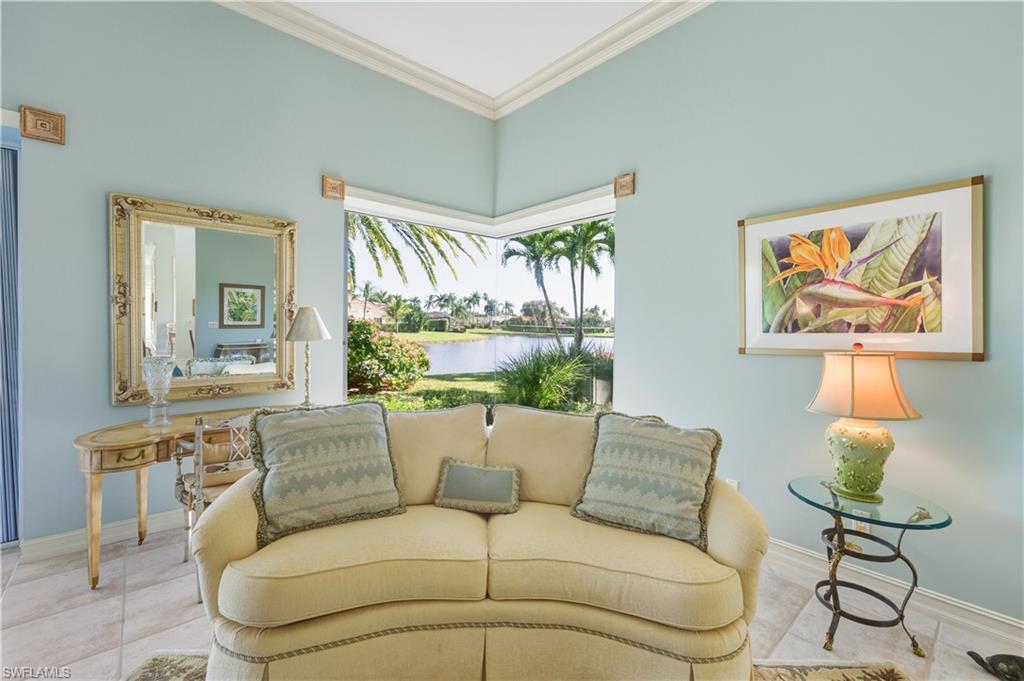 9264 Sweetgrass Way Naples, FL 34108 - Photo 15 of 40 a living room with furniture and a large window