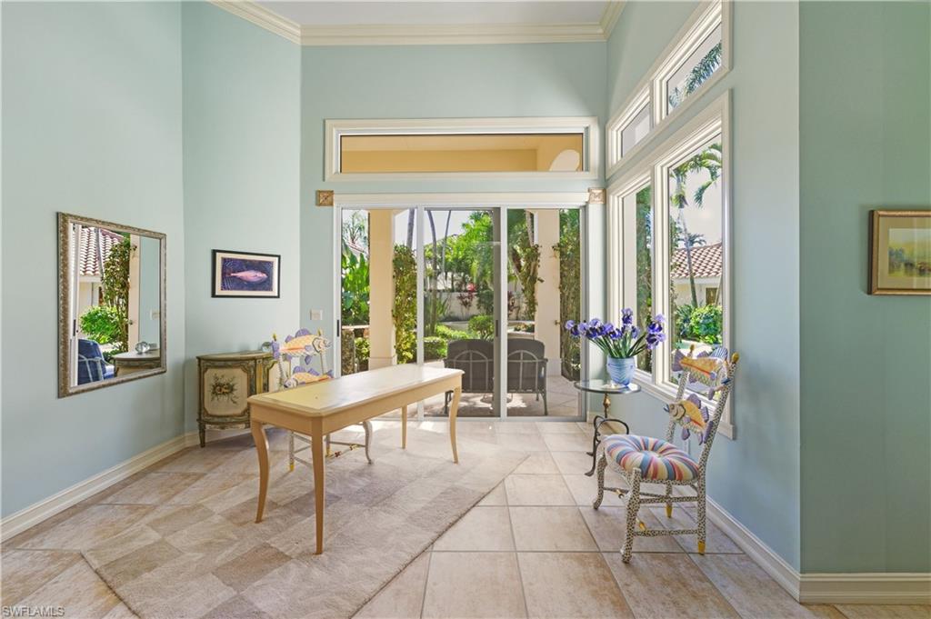 9264 Sweetgrass Way Naples, FL 34108 - Photo 22 of 40 a living room with furniture and a window