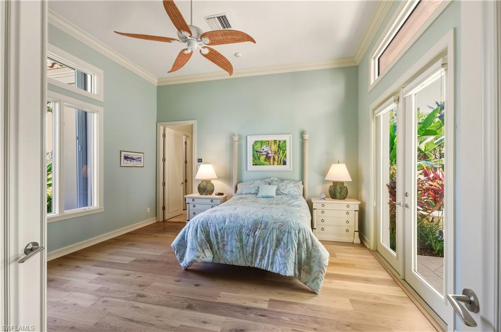9264 Sweetgrass Way Naples, FL 34108 - Photo 23 of 40 a bedroom with a bed and a window