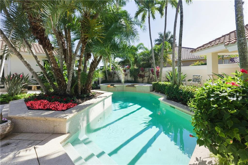 9264 Sweetgrass Way Naples, FL 34108 - Photo 38 of 40 a view of a garden with an outdoor seating