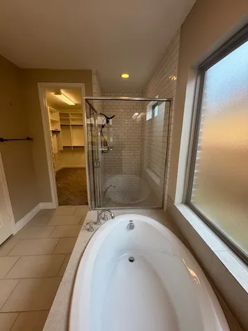 a spacious bathroom with a sink vanity and mirror