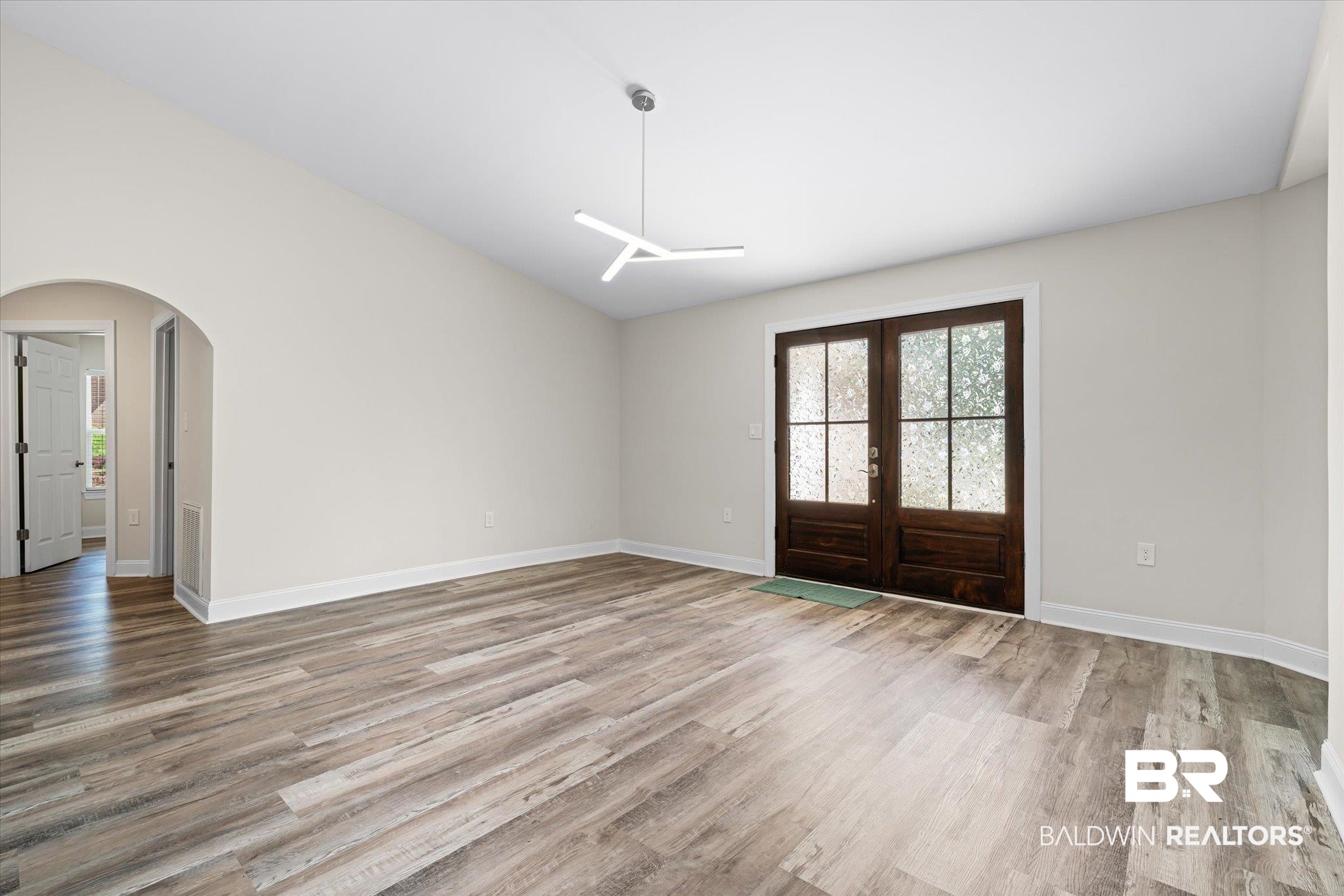 113 Pineridge Road Daphne, AL 36526 - Photo 2 of 22 Entryway featuring french doors, lofted ceiling, and hardwood / wood-style floors