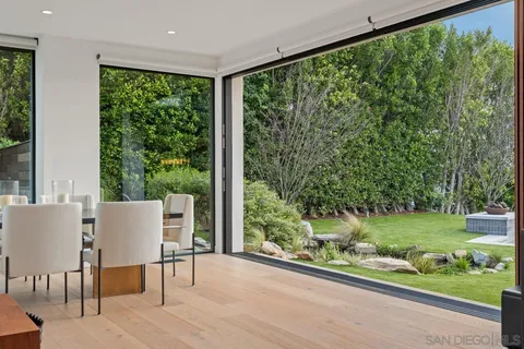 a view of a house with backyard porch and garden