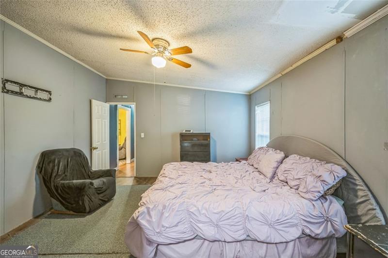 473 Haley Road Jackson, GA 30233 - Photo 7 of 13 a bedroom with a bed and couch